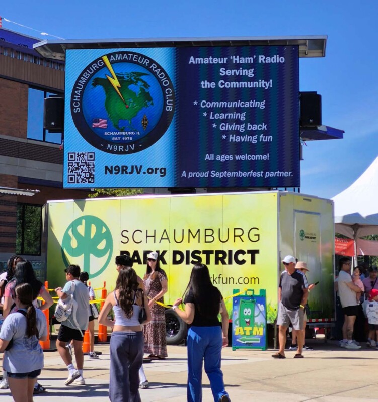 SARC’s community-service message on a large screen above a Schaumburg Park District trailer at Septemberfest.