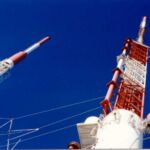 View straight up from the base of one of the combined antenna supports